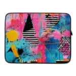 Laptop sleeve with a vibrant abstract design featuring blue, pink, purple, yellow, and black hues, secured with a zip closure. laptop sleeve kept on a plain white background