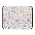 Terrazzo-style laptop sleeve with colorful spots in pink, blue, orange, and purple on a white background, laptop sleeve kept on a plain white background