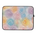 Laptop sleeve with a circular swirl pattern in pastel colors, including blue, pink, purple, yellow, and orange on a white background. laptop sleeve kept on a plain white background