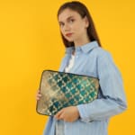 Infidu Rustic Beige Floral Blue Teal Laptop Sleeve with floral pattern in blue and teal tones on a faded beige background. the person holding the sleeve