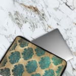 Infidu Vintage Floral Laptop Sleeve in blue, teal, and beige, with a classic floral pattern designed for laptop protection and style. The laptop sleeve covers the laptop