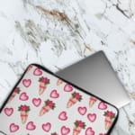 Infidu Romantic Heart & Floral Print Laptop Sleeve with pink hearts and flower bouquets on a white background. The laptop sleeve covers the laptop