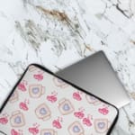 Infidu Cute Pink Heart Print Laptop Sleeve with Blue heart pattern on white background, perfect for stylish laptop protection. The laptop sleeve covers the laptop