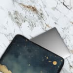 Infidu Night Sky Laptop Sleeve with Stars, Moon, and Clouds design on a dark blue background, offering a dreamy celestial theme for laptop protection. The laptop sleeve covers the laptop