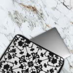 Infidu black and white mandala art laptop sleeve with intricate floral design. The laptop sleeve covers the laptop