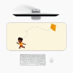 Infidu desk pad featuring a child flying an orange kite against a light sandal background. A desk pad under the computer