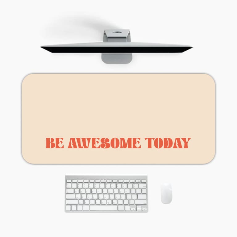 Infidu desk pad with 'Be Awesome Today' in orange text on a beige background, providing a motivational and stylish desk mat. A desk pad under the computer