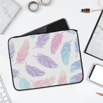 Infidu Pastel Feather Laptop Sleeve with soft fabric in pink, blue, and purple shades, featuring a zip closure for secure laptop protection. laptop sleeve kept on a plain white background