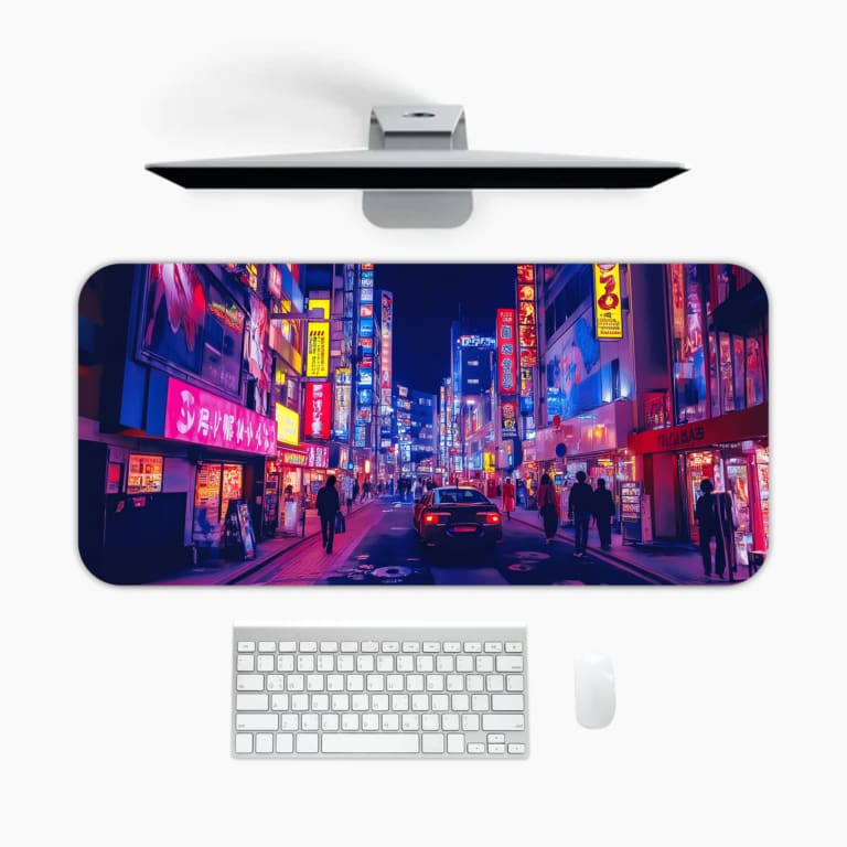 Infidu Neon City Street Desk Pad features a vibrant nighttime city scene with neon lights in pink, purple, yellow, and blue, perfect for any desk setup. A desk pad under the computer