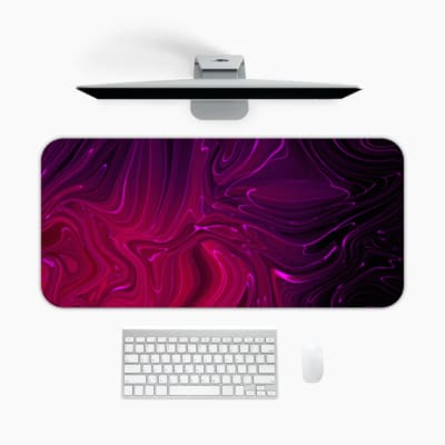 Infidu Desk Pad with a swirling marble design in shades of purple and pink, showcasing a smooth, flowing texture for a dreamy aesthetic. A desk pad under the computer