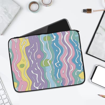 Retro-inspired laptop sleeve with wavy pastel stripes in pink, purple, yellow, green, and blue, covering the surface with a zip closure. laptop sleeve kept on a plain white background