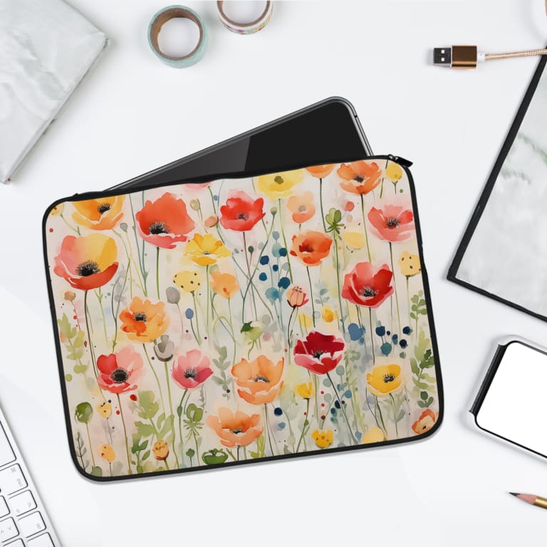 Colorful floral laptop sleeve with red, pink, yellow, and orange flowers on a light background. laptop sleeve kept on a plain white background