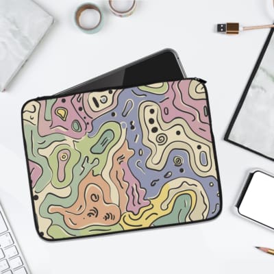 Laptop sleeve with topographic map design in pastel colors, featuring contour lines on a neutral background. laptop sleeve kept on a plain white background