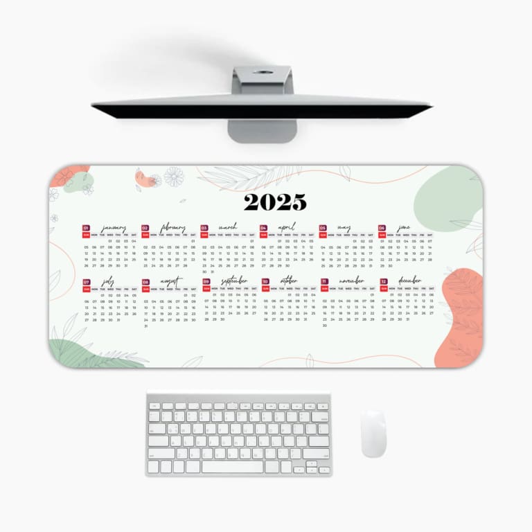 Infidu Calendar Design Desk Pad displaying a 2025 calendar layout with a light background and abstract red and gray accents. A desk pad under the computer