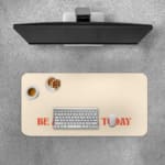 Infidu desk pad with 'Be Awesome Today' in orange text on a beige background, providing a motivational and stylish desk mat. Desk Pad with Keyboard and Mouse on top of the desk pad