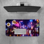 Infidu Neon City Street Desk Pad with a vibrant urban night scene featuring neon lights, tall buildings, and colorful reflections on wet pavement. A desk pad under the computer