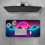 Infidu Wave Design Desk Pad features a neon landscape with a glowing purple and pink sun, wave patterns, and an 80s vaporwave aesthetic. A desk pad under the computer