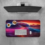 Infidu Vibrant Ocean Wave Design Desk Pad showcases colorful waves in shades of purple, pink, blue, and red against a dramatic sky. Desk Pad with Keyboard and Mouse on top of the desk pad