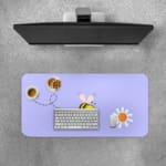 Cute bee desk pad with light blue background and playful flower design, perfect for adding a fun touch to any desk Desk Pad with Keyboard and Mouse on top of the desk pad