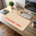 Infidu desk pad with 'Be Awesome Today' in orange text on a beige background, providing a motivational and stylish desk mat. desk pad kept on the table