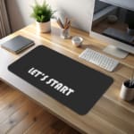 Infidu Let’s Start Desk Pad with white text on a black background, motivational design desk pad kept on the table