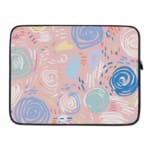 An abstract pastel laptop sleeve in pink, blue, and light green with circular and swirl patterns on a white background with a zip closure. laptop sleeve kept on a plain white background