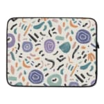 Organic abstract laptop sleeve with hand-drawn patterns in coral, purple, mint green, and black on a white background with a zip closure. laptop sleeve kept on a plain white background