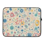 Laptop sleeve with a pastel bubble pattern in light blue, coral pink, and peach circles on a white background, secured with a zip closure. laptop sleeve kept on a plain white background