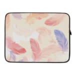 Laptop sleeve with a soft pastel feather design in pink, blue, purple, and orange on a light background, featuring a secure zip closure. laptop sleeve kept on a plain white background