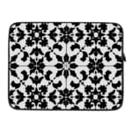 Infidu Black & White Laptop Sleeve with intricate symmetrical floral and geometric patterns, bold and stylish protective laptop case. laptop sleeve kept on a plain white background