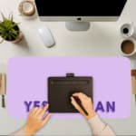 Infidu Yes You Can Desk Pad featuring motivational purple text on a minimalist purple background, perfect for inspiring confidence at your desk. A writing pad on top of the desk pad